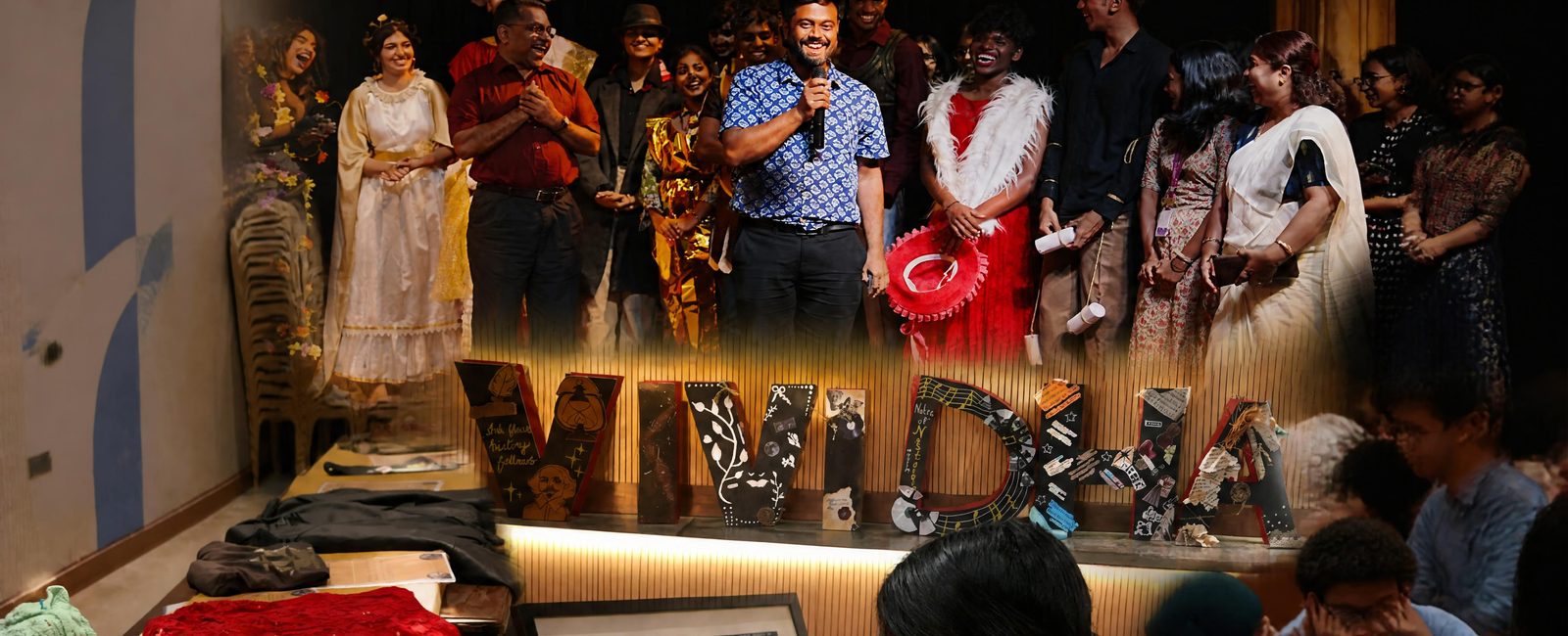 Students on stage at a department event